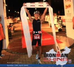 Steve crosses the finish line at Ironman China triathlon