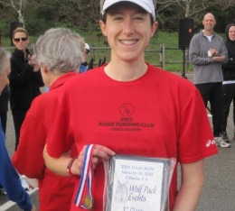 Samo poses with her award plaque for finishing 1st at local duathlon