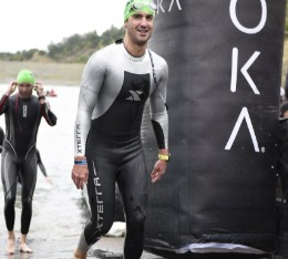 Man finishes the swim portion of a triathlon