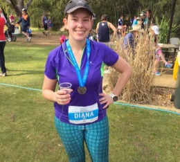 Diana with her finisher medal after the Zoo Zoom in Australia.