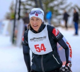 Woman on XC ski portion of winter triathlon.