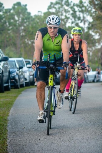 Man and woman on bicycle in aquabike race