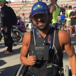 Daniel poses with his triathlon award.