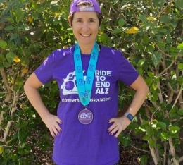 Hypercat athlete Julie poses with her finisher medal and t-shirt.